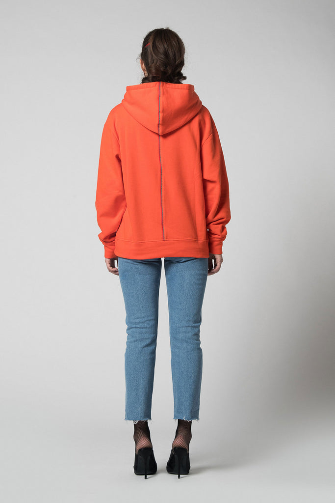 This orange cotton hoodie has a removable hood and adjustable length. The hoodie as well has a reflective tape and embroidery.